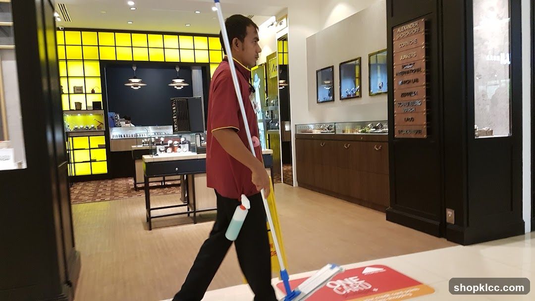 Cleaning Staff in Store Interior