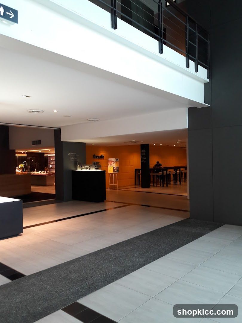 Interior of a modern building lobby with cafe area