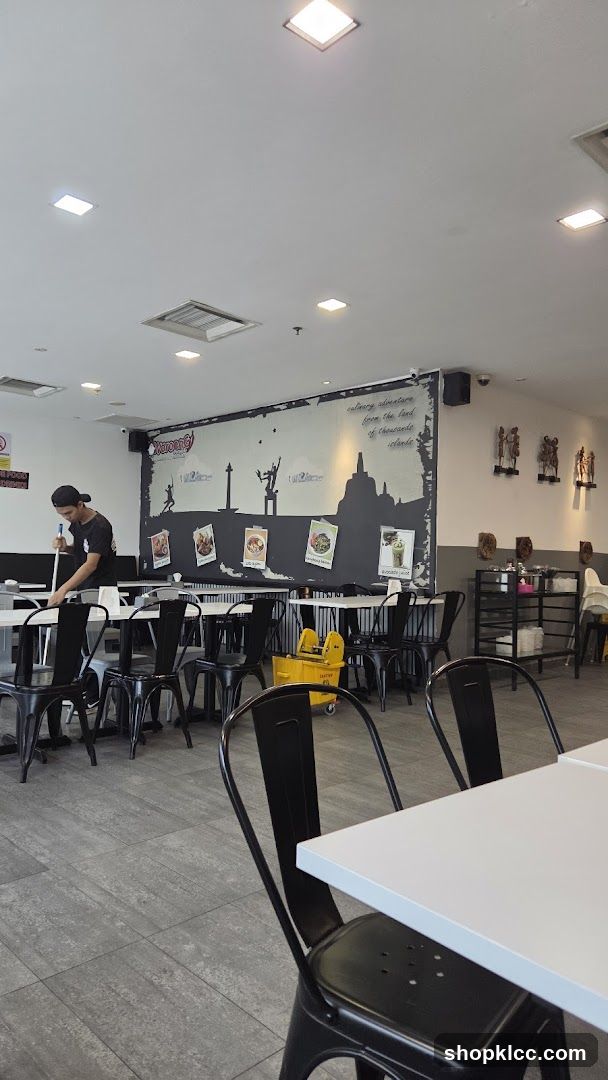 Restaurant Interior with Staff Cleaning
