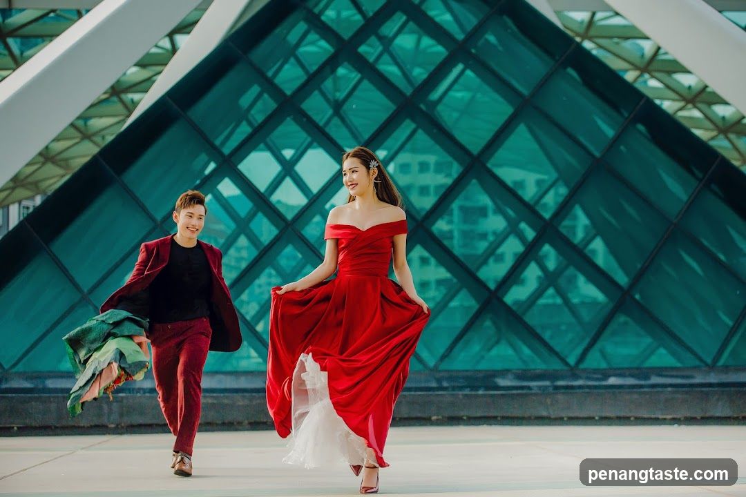 Couple Posing in Front of Modern Architecture