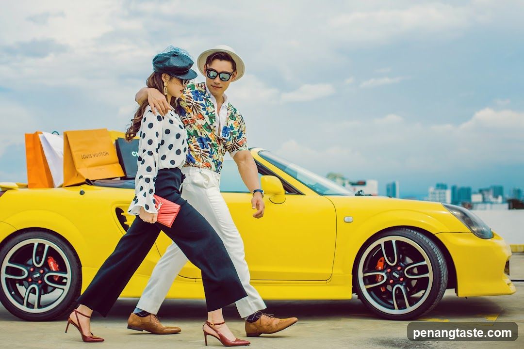 Couple with Shopping Bags and Yellow Car