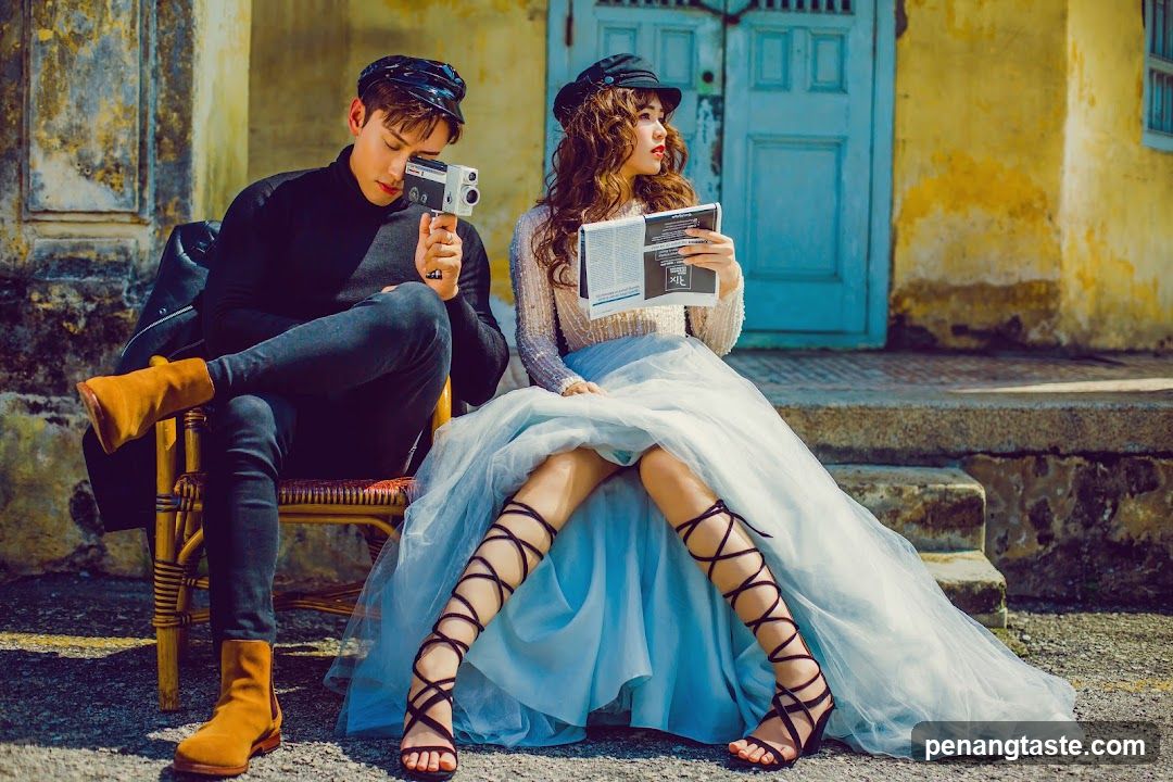 Couple Posing with Vintage Camera and Magazine