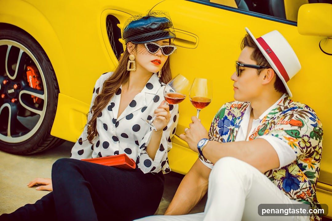 Couple with Wine Glasses by Yellow Car