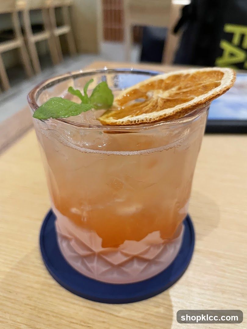 Cocktail with Orange Slice and Mint