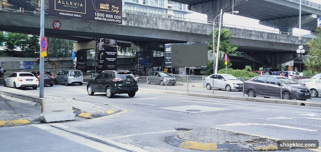 Urban street scene with vehicles and billboards