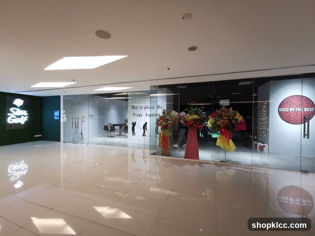 Interior of a modern retail or office space with glass storefront and floral arrangements