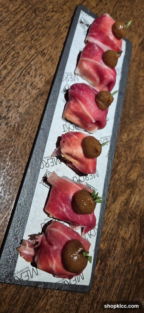 Sliced Meat with Olives on Slate Platter