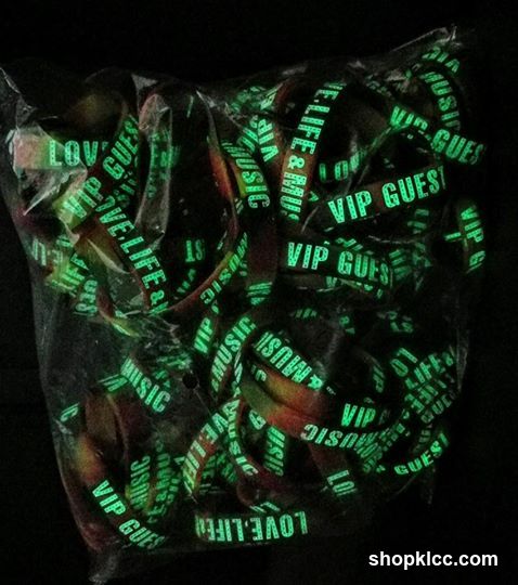glowing green wristbands in a bag
