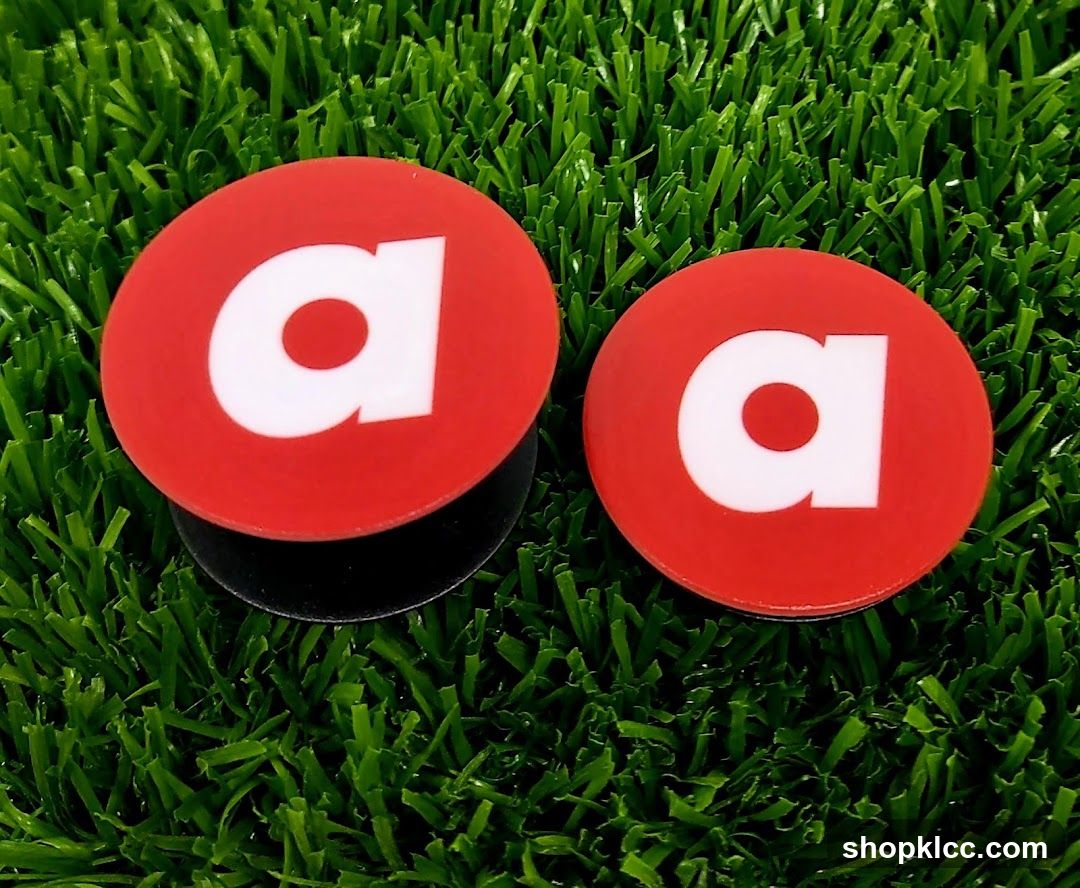 Red 'a' Plugs on Grass