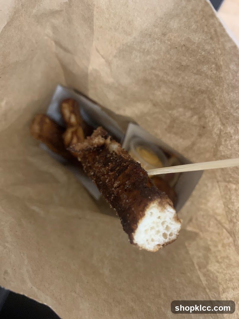 Churros in a paper bag