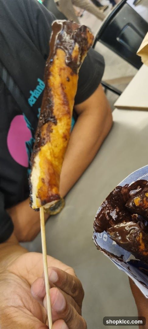 Chocolate-covered pastry on a stick