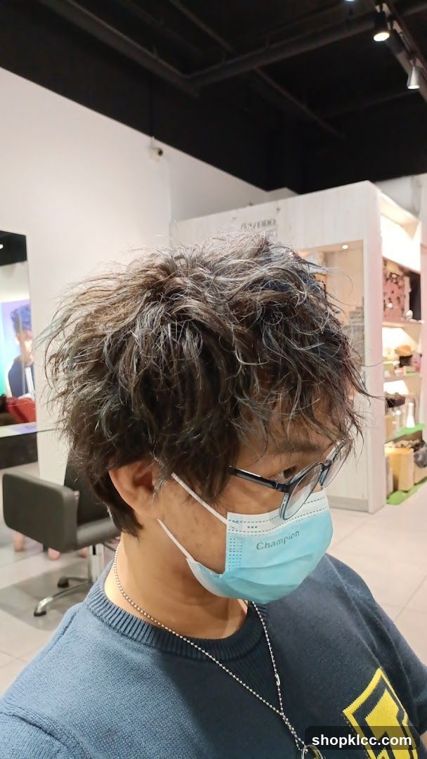 Person with mask and glasses in store interior