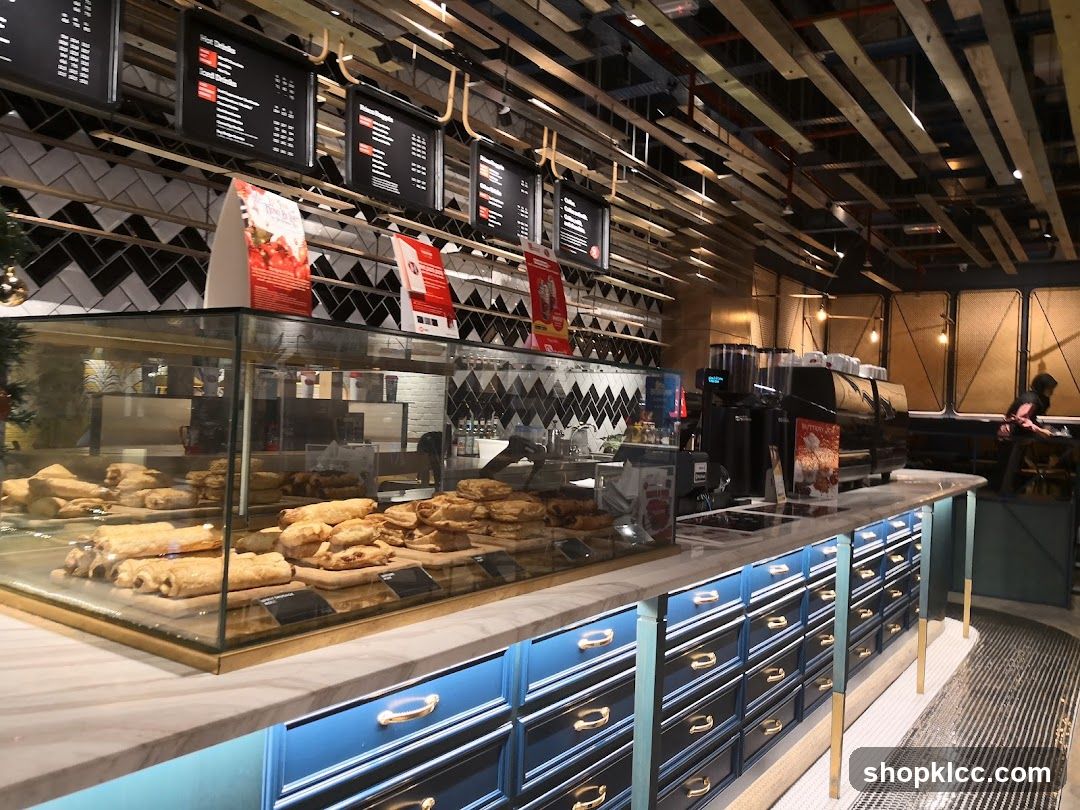 Cafe Interior with Pastries and Coffee Machines