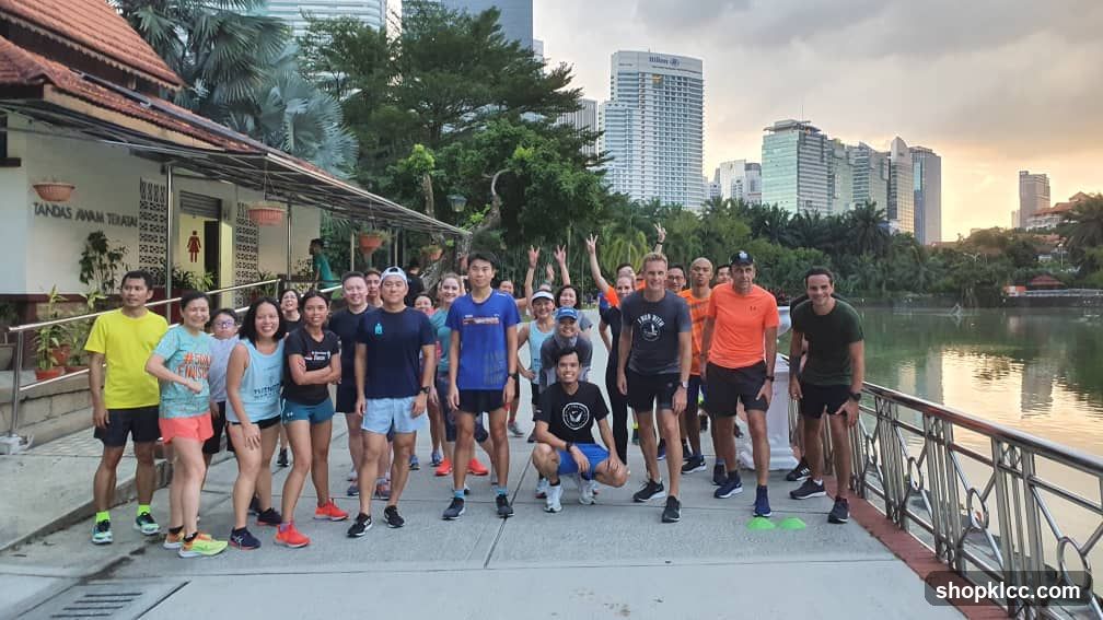 Group photo near shop with city skyline