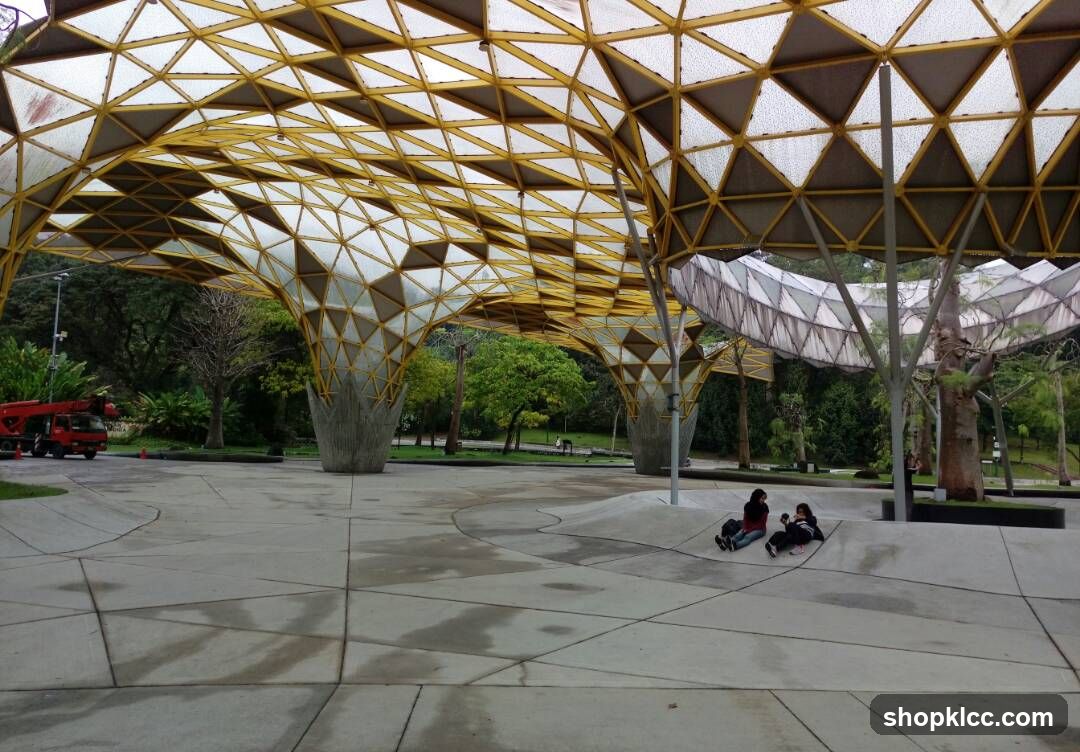 Geometric Pavilion with People Relaxing