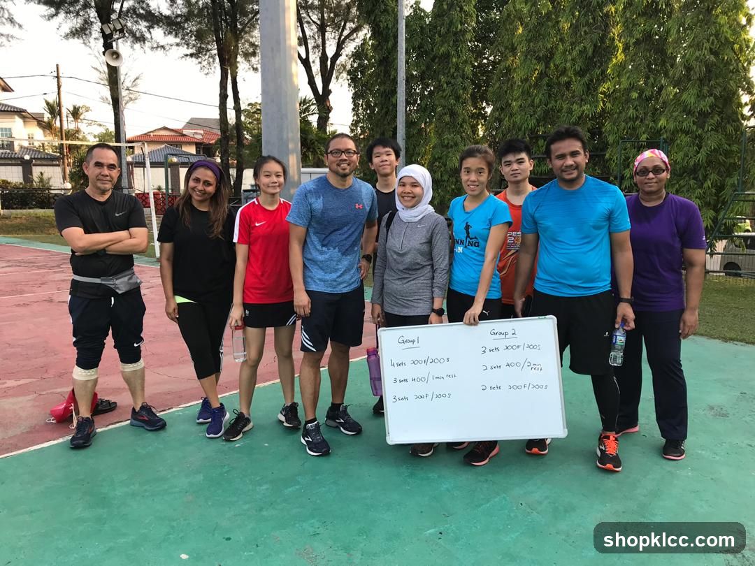 Group of people holding a whiteboard with workout schedule