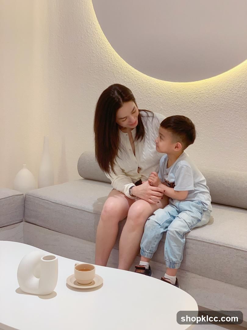 Mother and son sitting on a couch