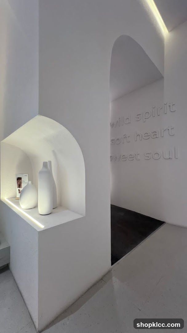 Interior with decorative vases and text on wall