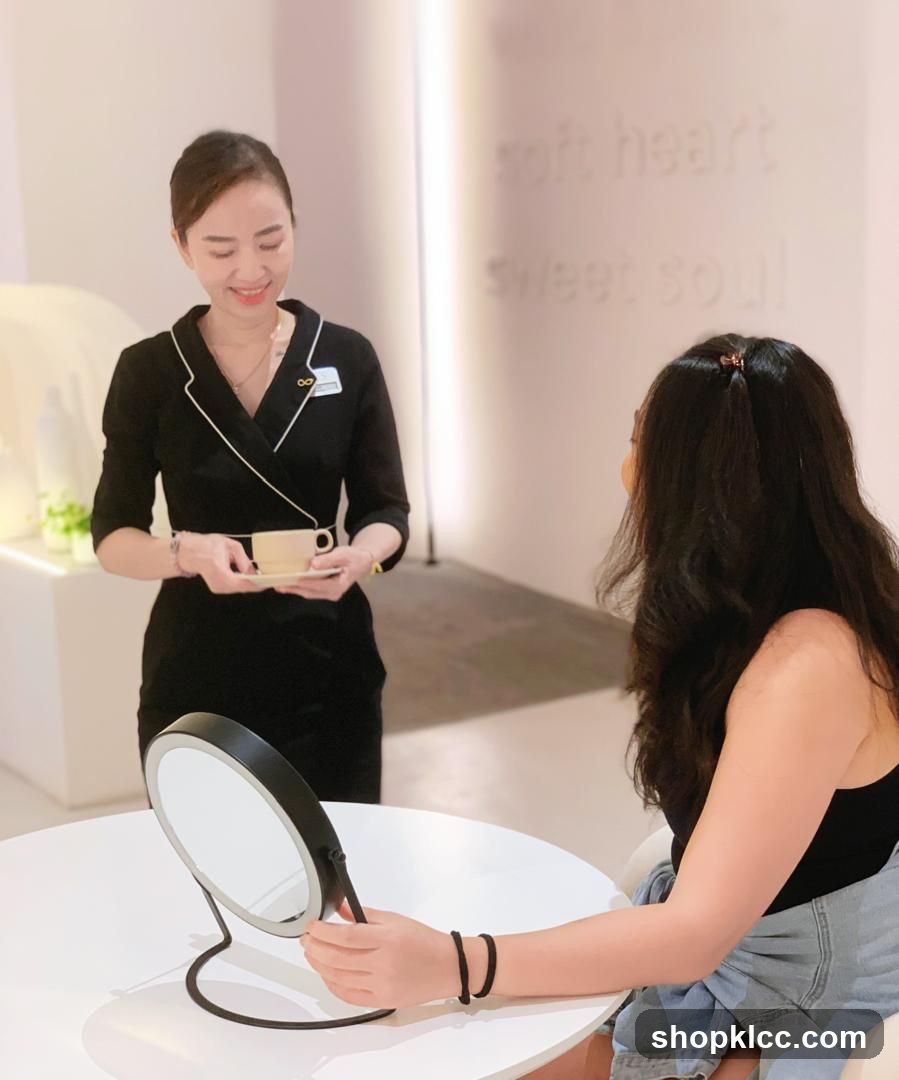 Spa attendant serving tea to a client