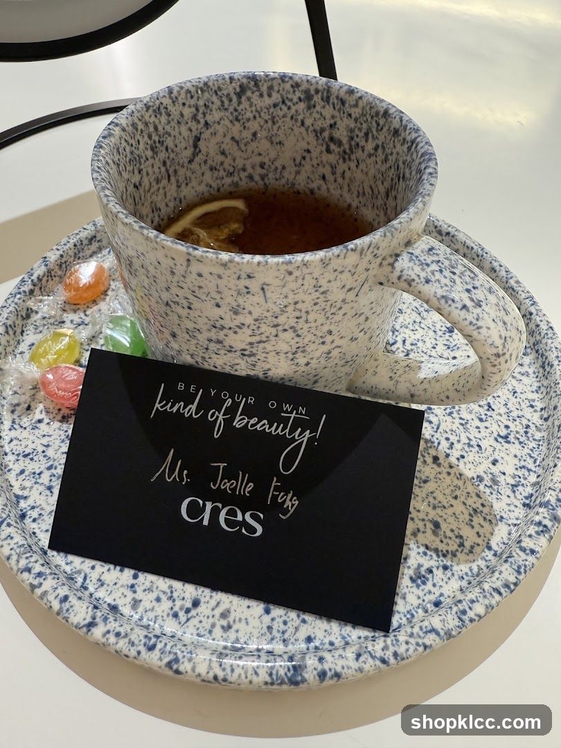 Tea with a business card and candies