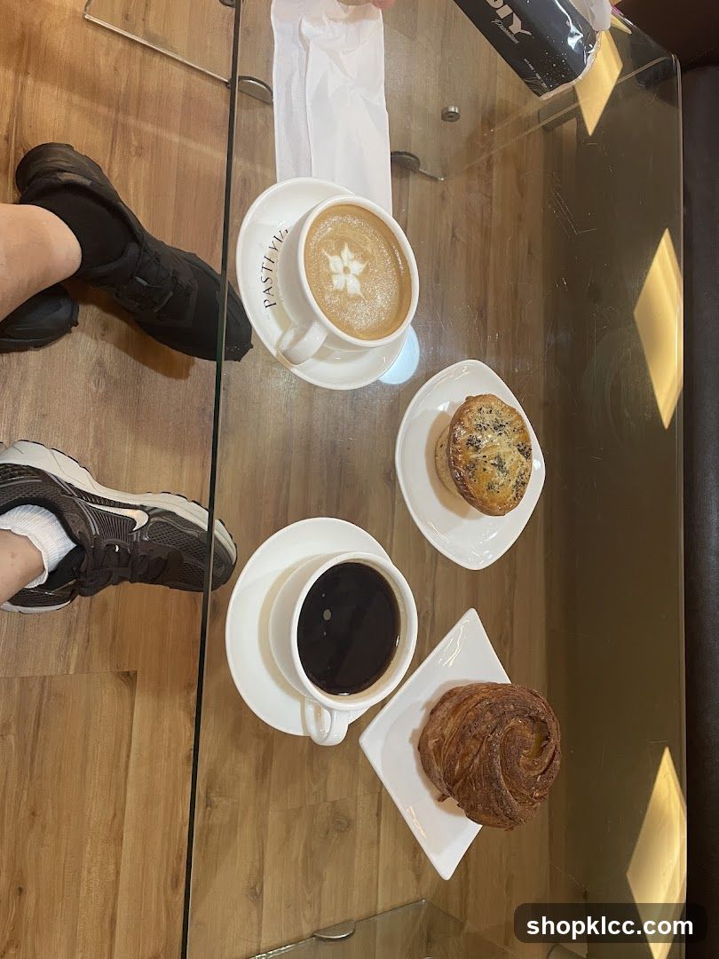 Coffee and Pastries on Glass Table