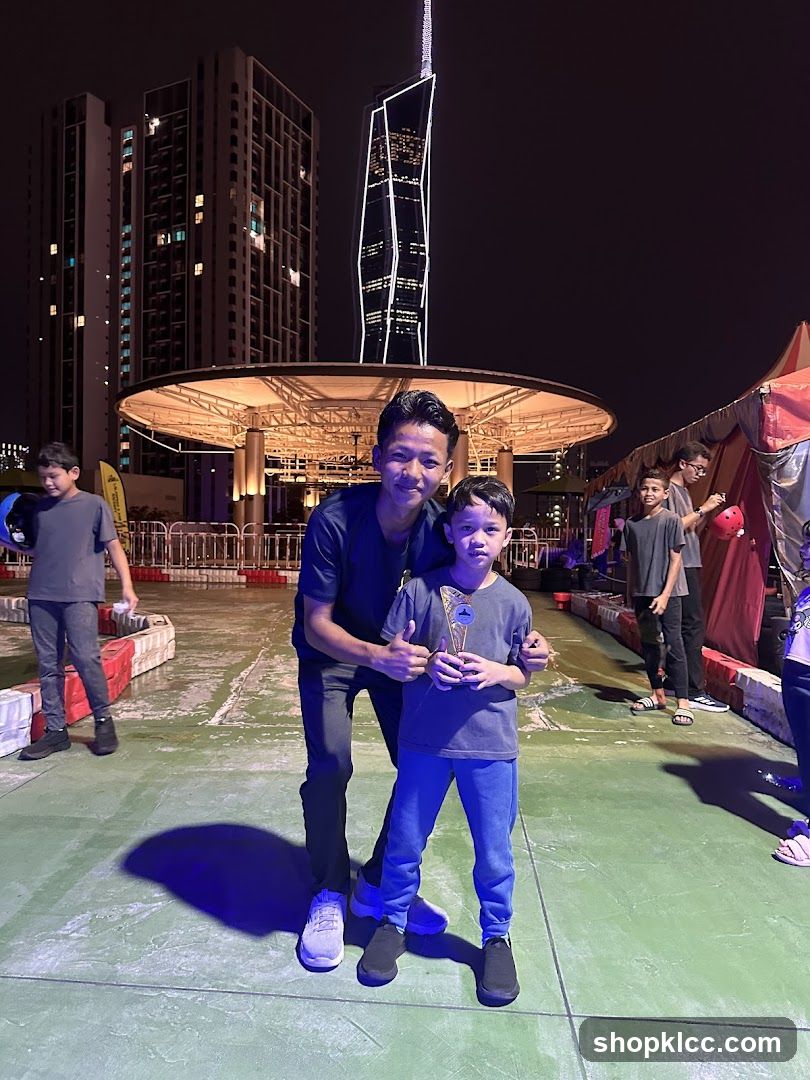 Two boys posing for a photo at night