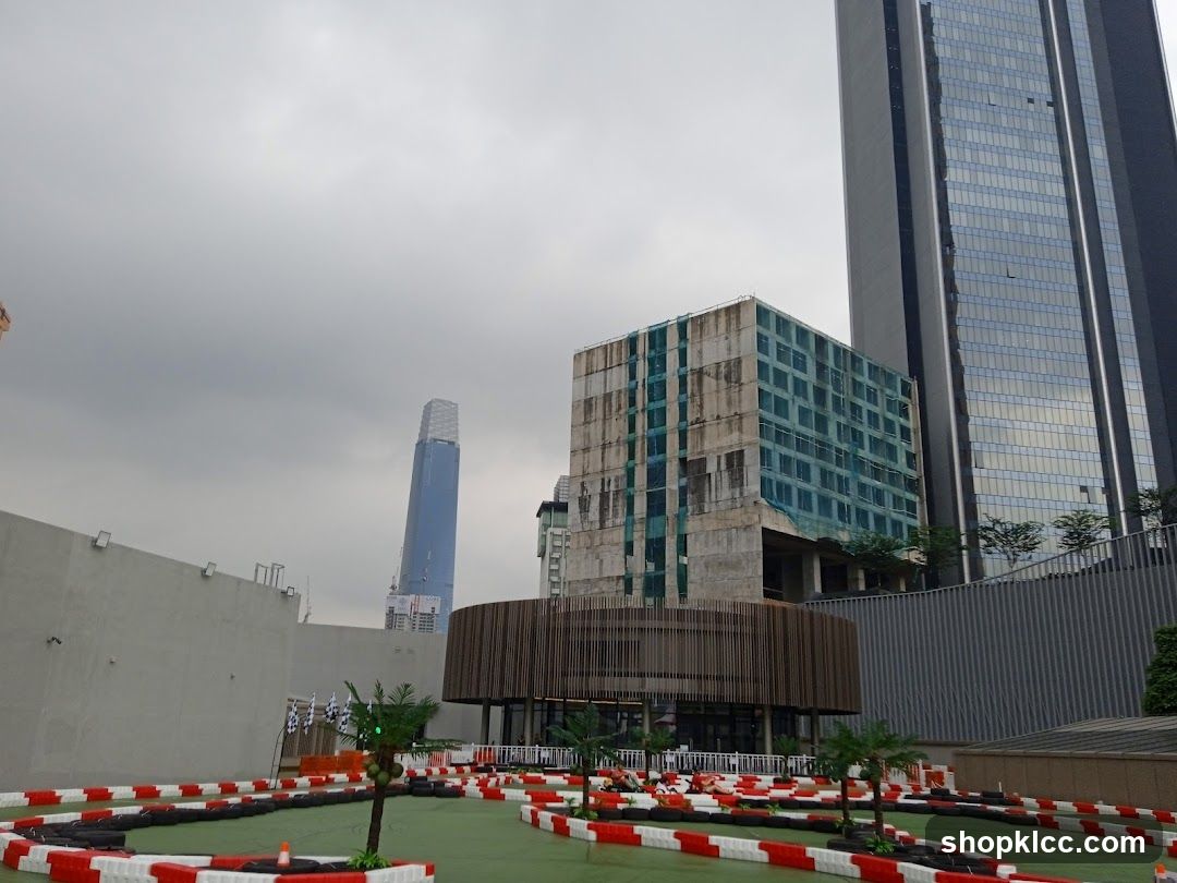 Outdoor Go-Kart Track with Cityscape Background