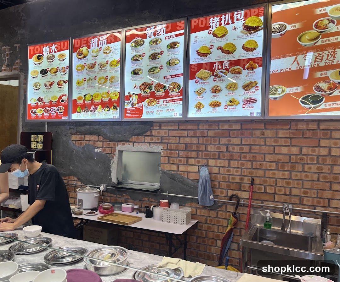 Dining Area with Menu Boards and Staff