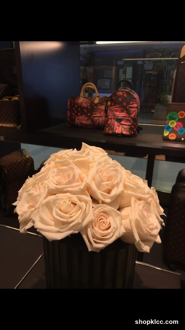 Flower Arrangement and Designer Bags