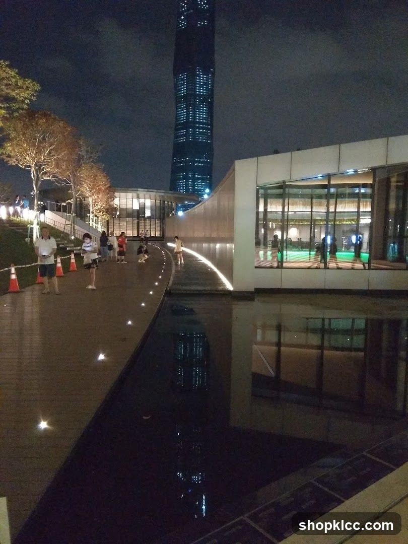 Modern Building with Reflecting Pool at Night