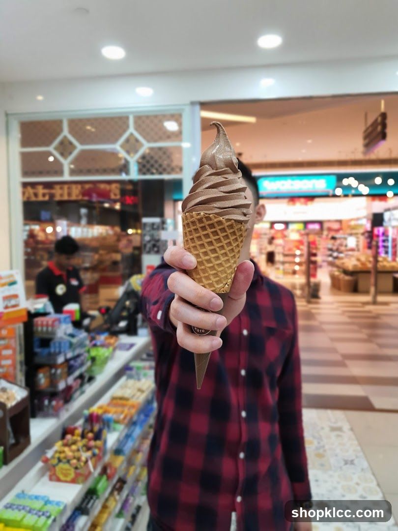 Person holding an ice cream cone