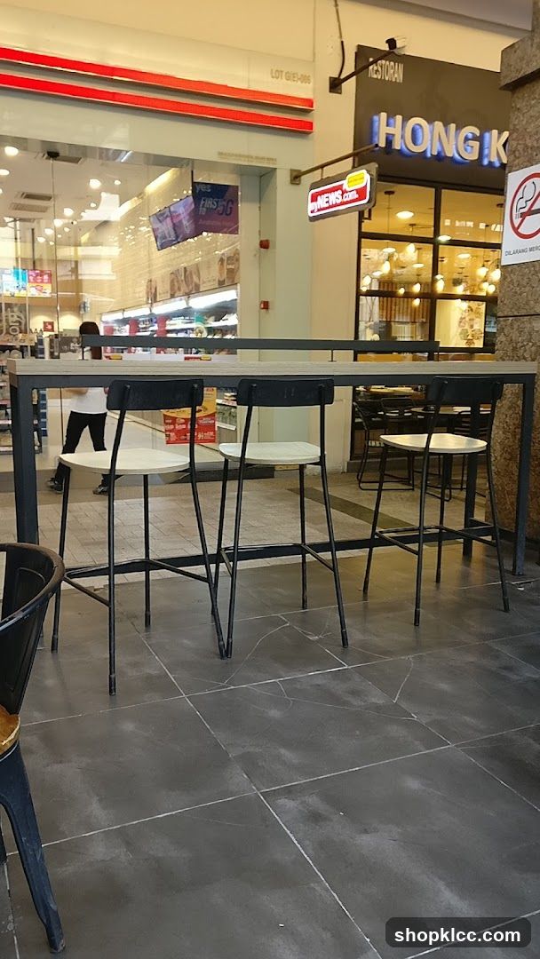 High Table and Chairs in Front of Shops