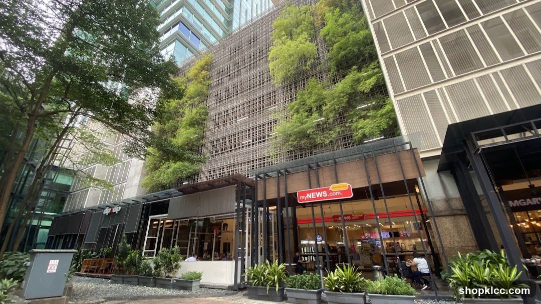 Modern building with a vertical garden and storefronts