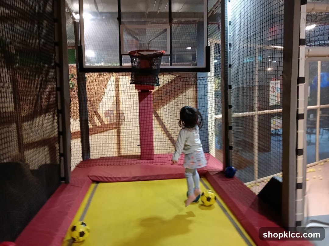 Child Playing with Balls on Trampoline