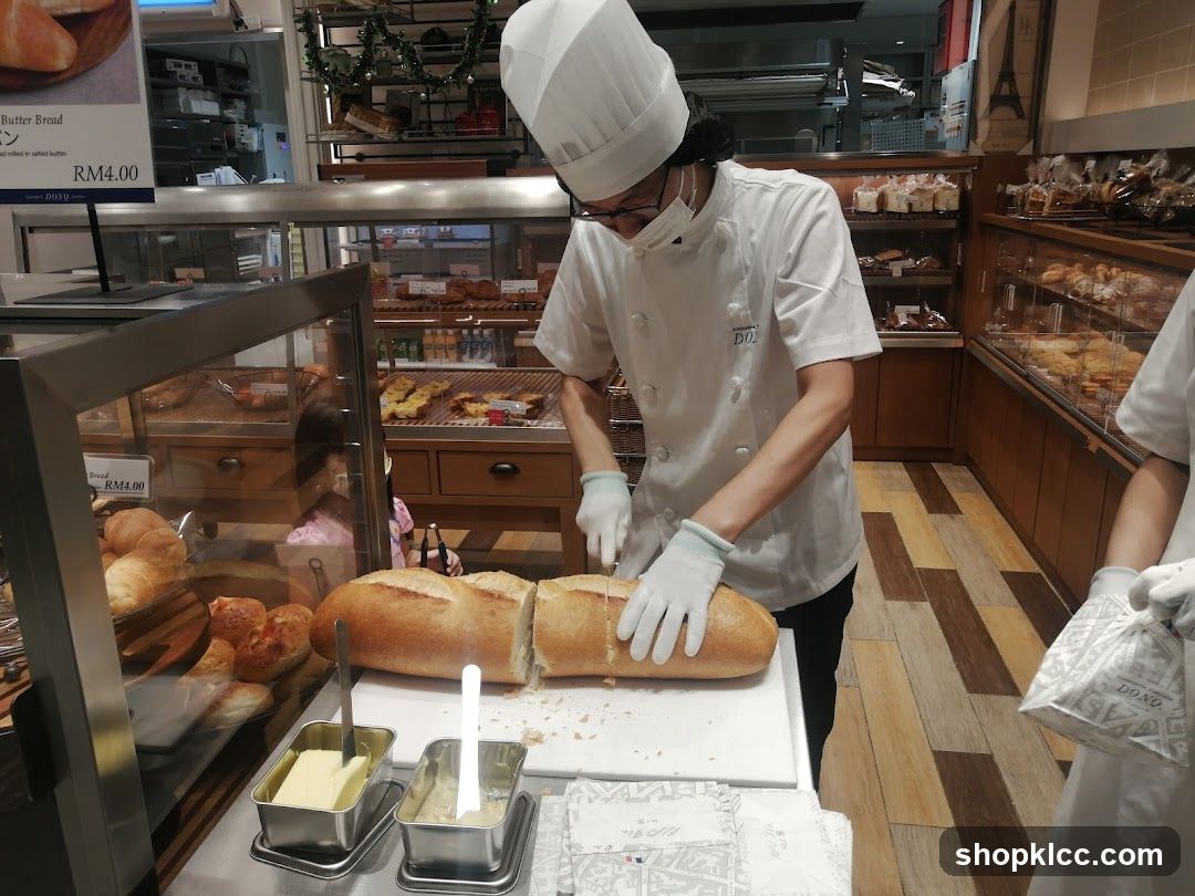Bakery Interior with Staff Preparing Bread