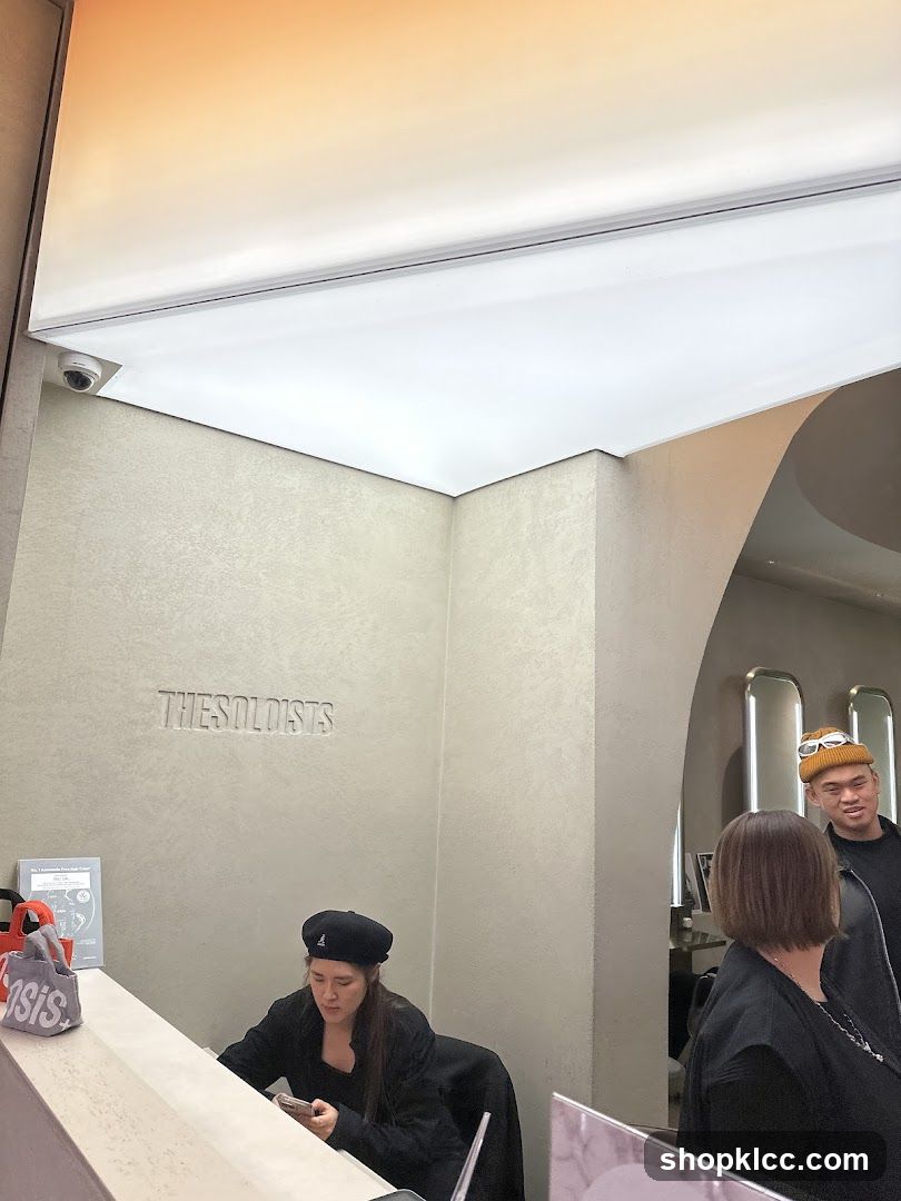 Interior of a store with staff and customers