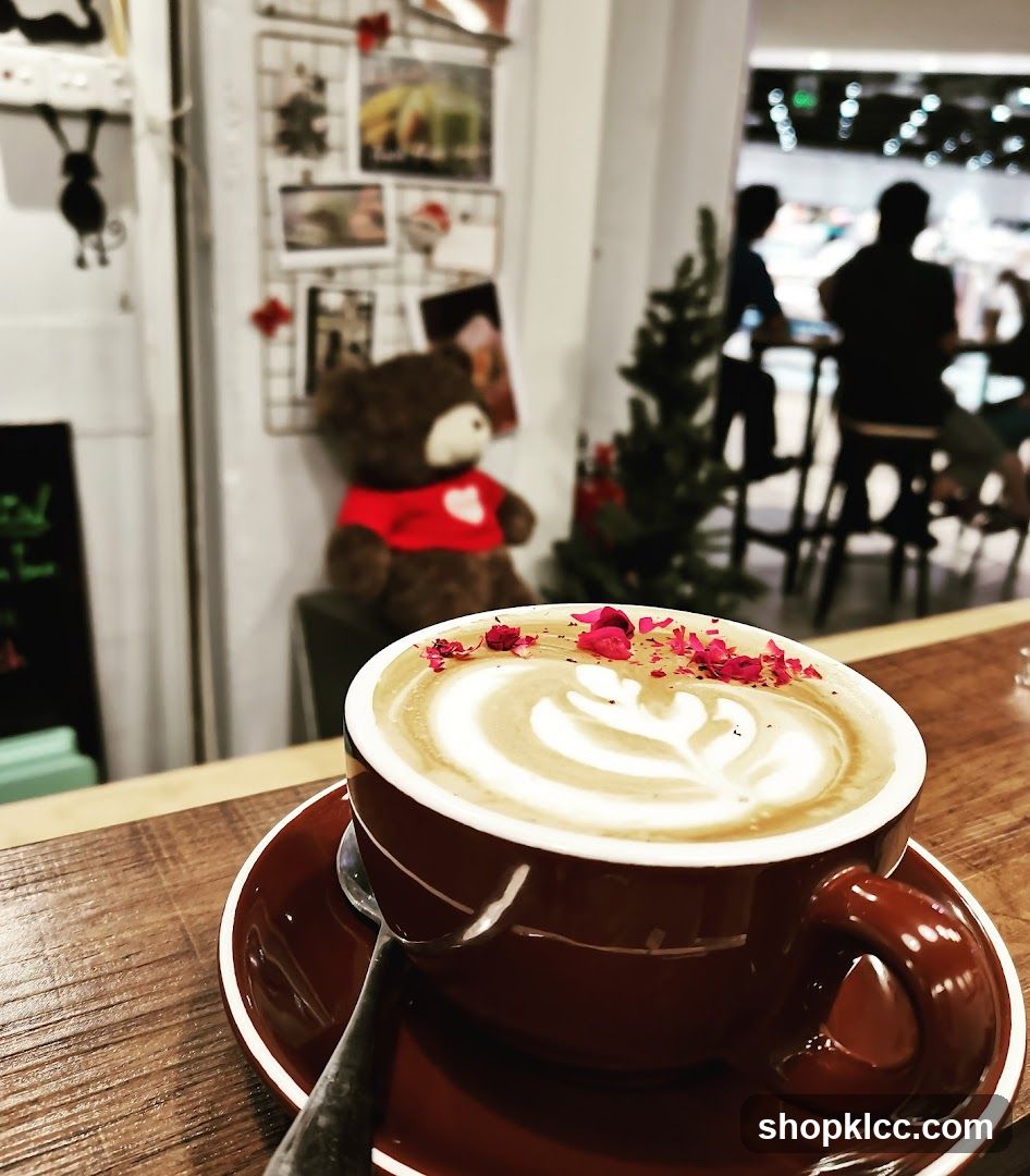Latte with Rose Petals in Cafe Interior