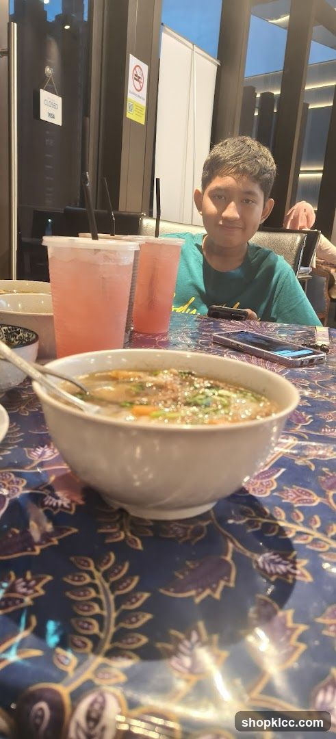 Boy at Restaurant Table