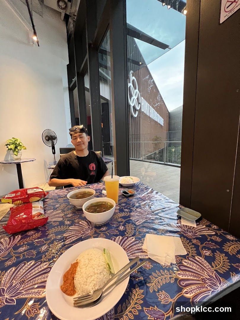 Man Sitting at a Table with Food