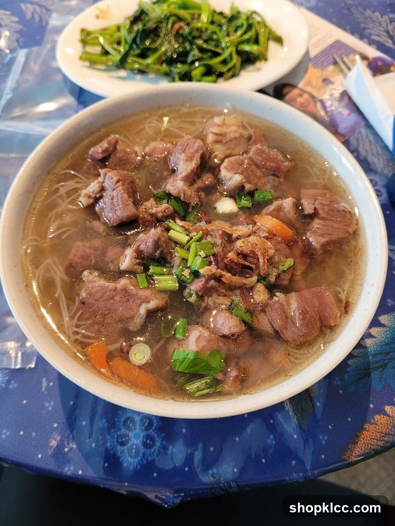 Beef noodle soup with greens