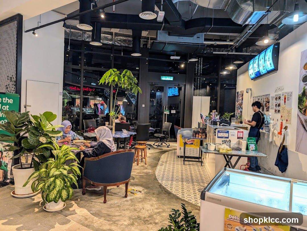 Interior of a cafe with customers and staff