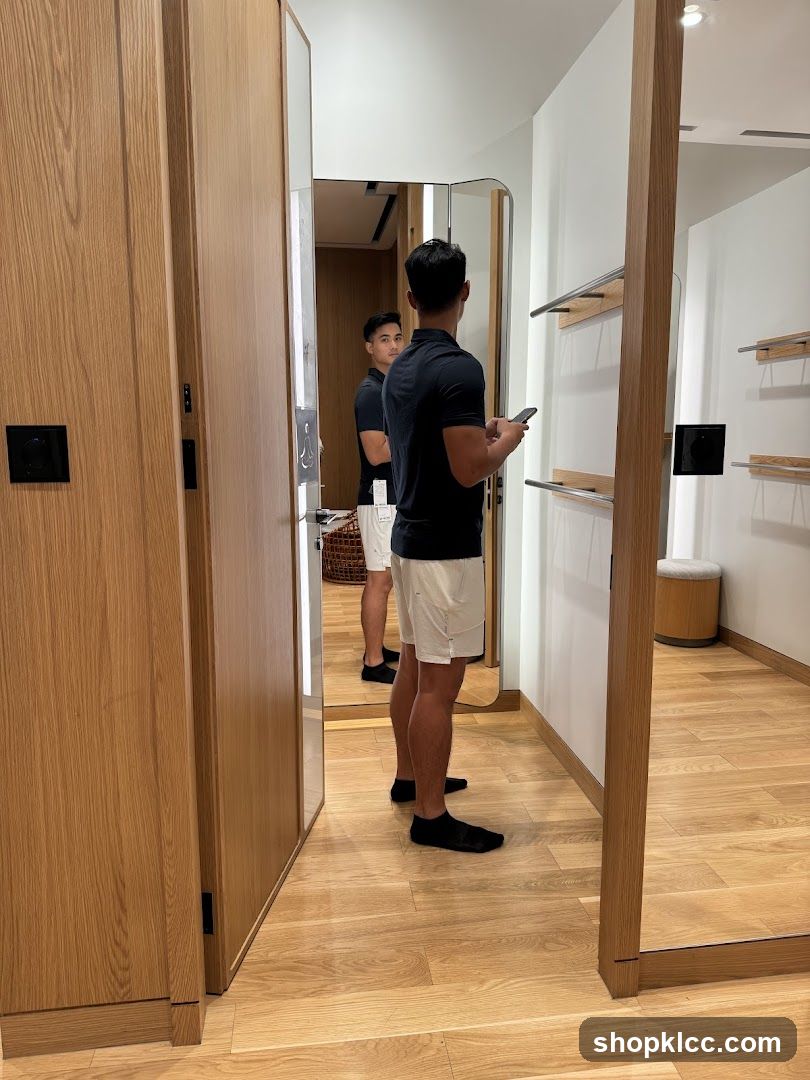 Man Trying On Clothes in Fitting Room