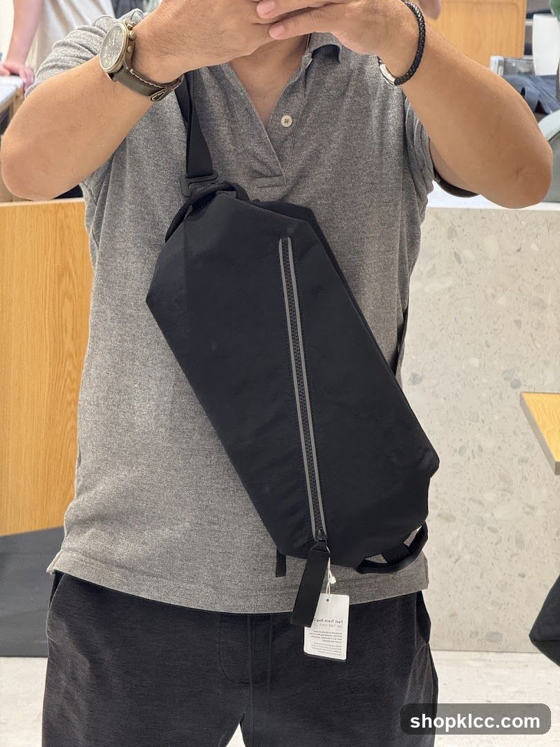 Man wearing a black sling bag