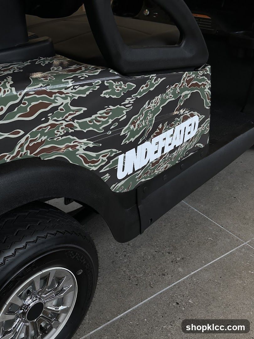 Golf Cart with Camouflage Wrap and "UNDEFEATED" Logo