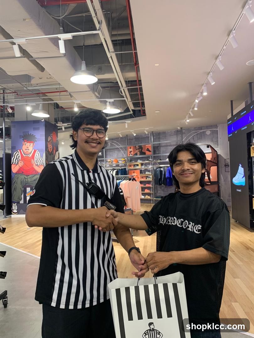 Two men shaking hands in a store