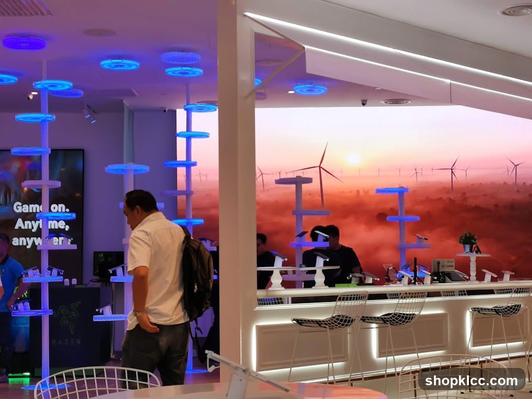Modern electronics store with display shelves and a scenic backdrop