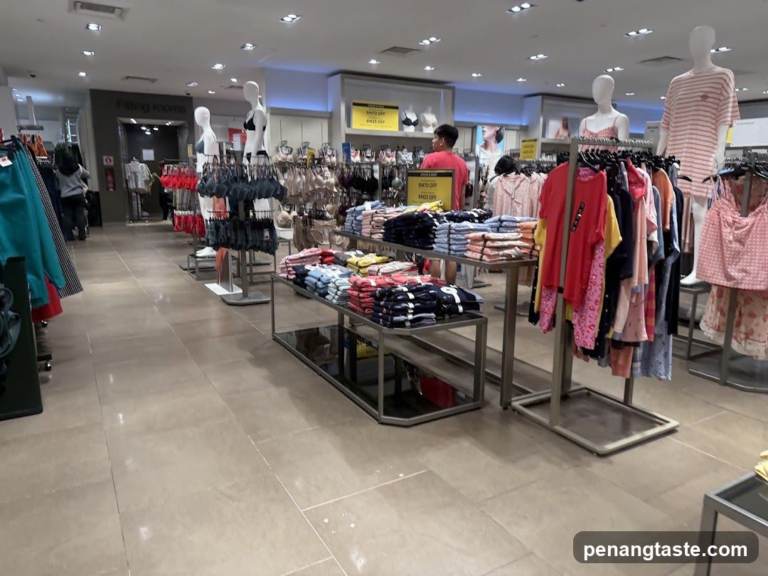 Clothing store interior with displays of apparel
