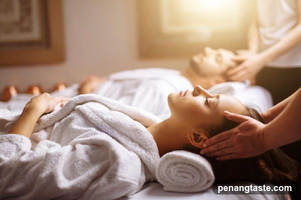 Couple receiving head massages
