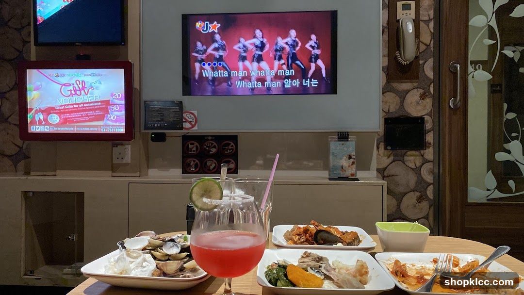 Karaoke room with food and drinks