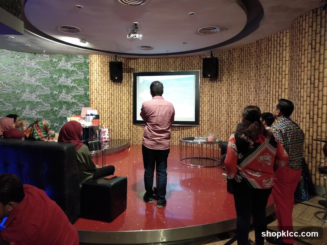 Karaoke room with screen and audience